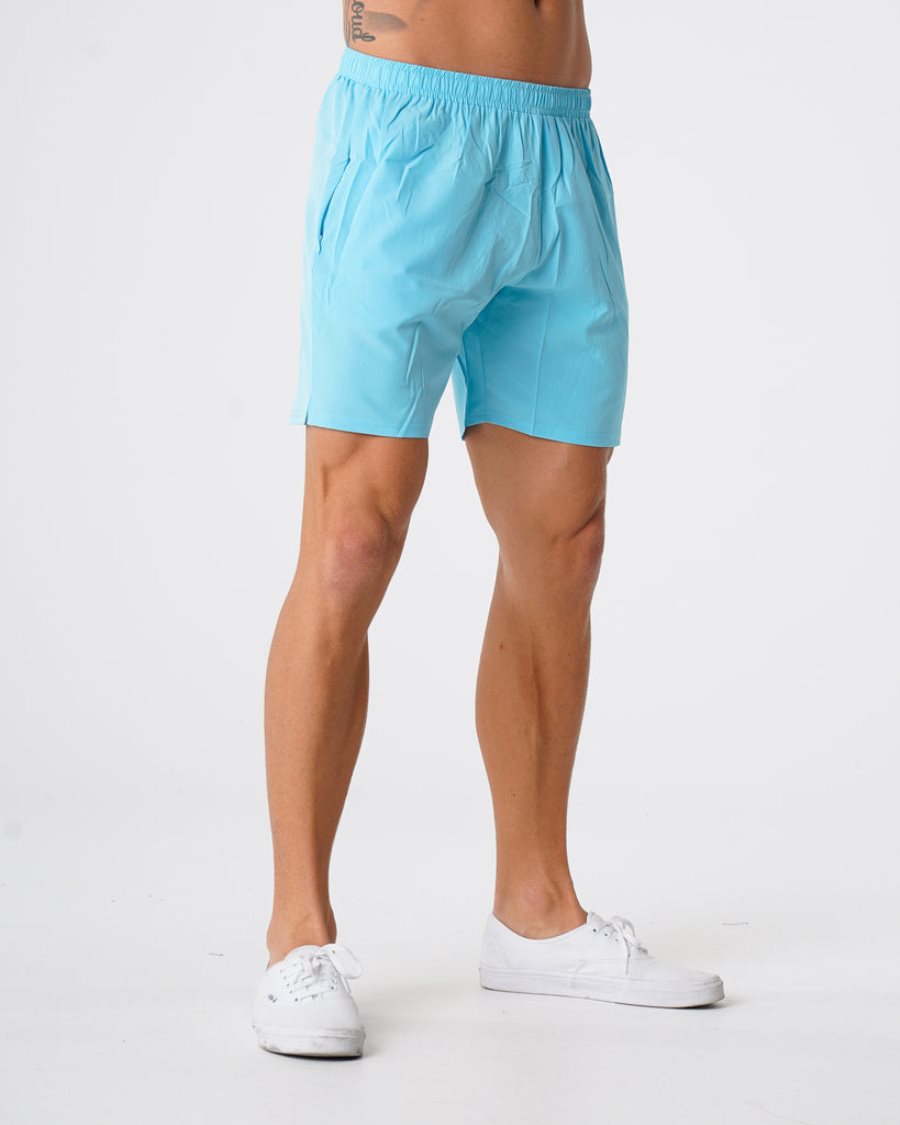 Light Turquoise Men's NVGTN Flex Shorts Dubai | NToetExi